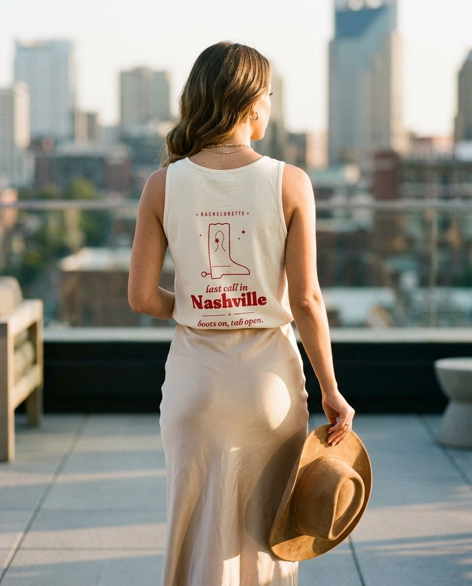 Nashville Bachelorette Tank Top in Ivory with a satin slip skirt on a rooftop